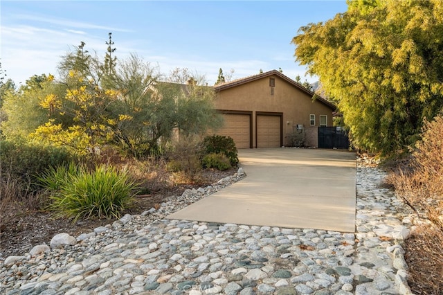 view of property exterior featuring a garage