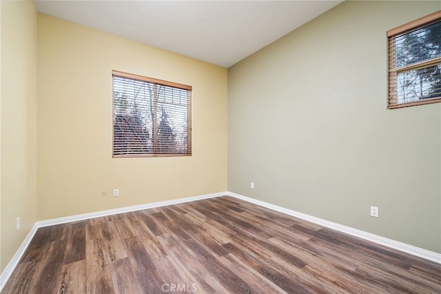 spare room with hardwood / wood-style floors