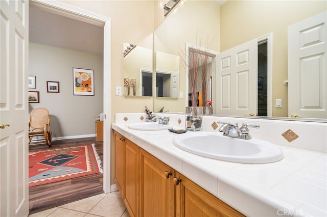 bathroom with tile patterned flooring and vanity