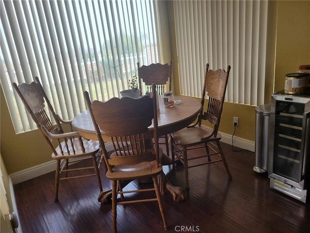 dining room with wine cooler and dark wood-type flooring