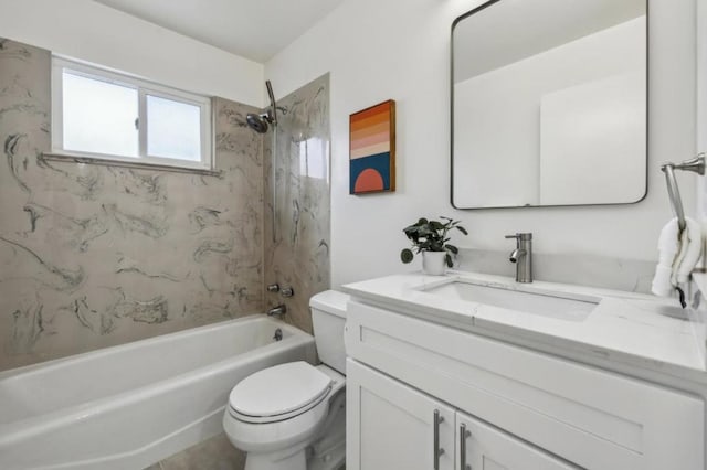 full bathroom with tiled shower / bath, vanity, and toilet