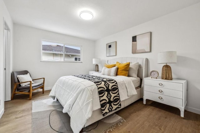 bedroom with wood-type flooring