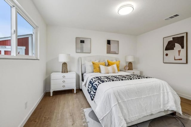 bedroom with light hardwood / wood-style flooring