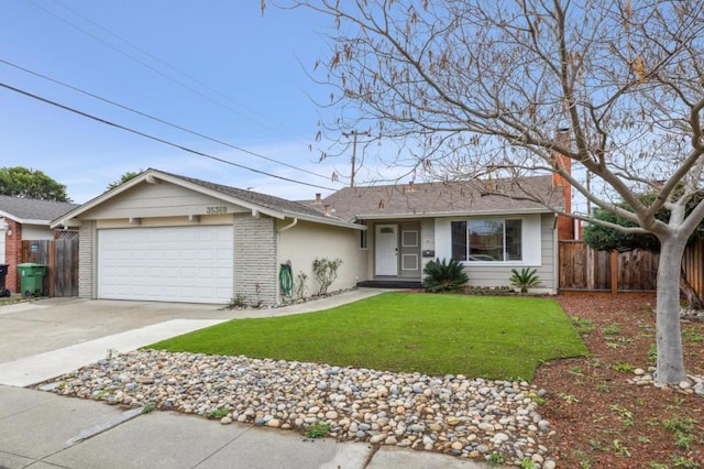 ranch-style house featuring a garage and a front lawn