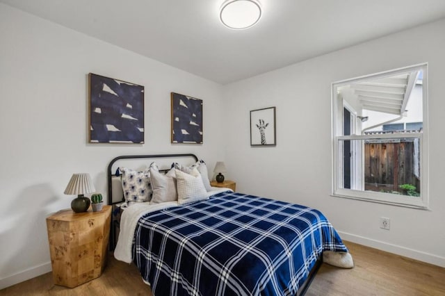 bedroom featuring wood-type flooring