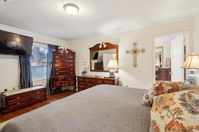 bedroom featuring dark wood-type flooring