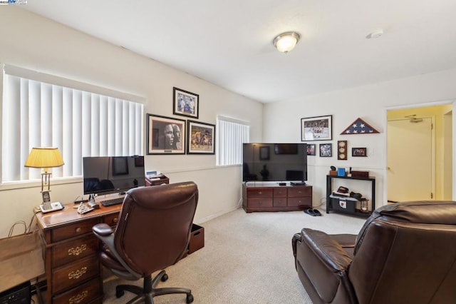 office featuring a healthy amount of sunlight and light colored carpet