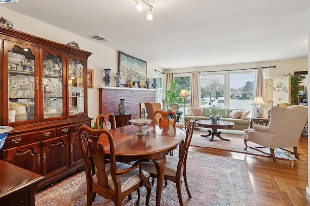 dining space featuring light parquet flooring