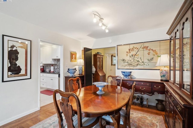 dining area with light hardwood / wood-style floors