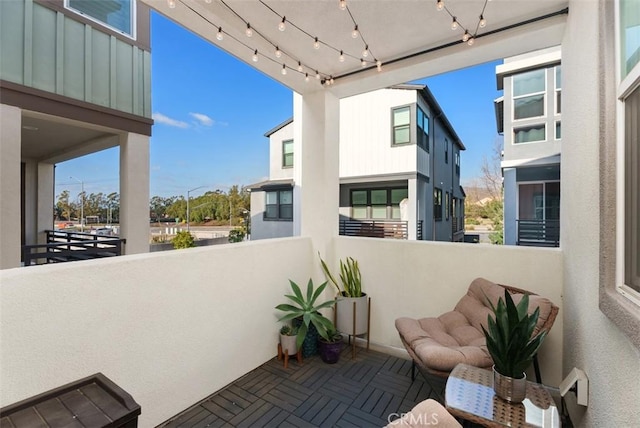 view of patio featuring a balcony