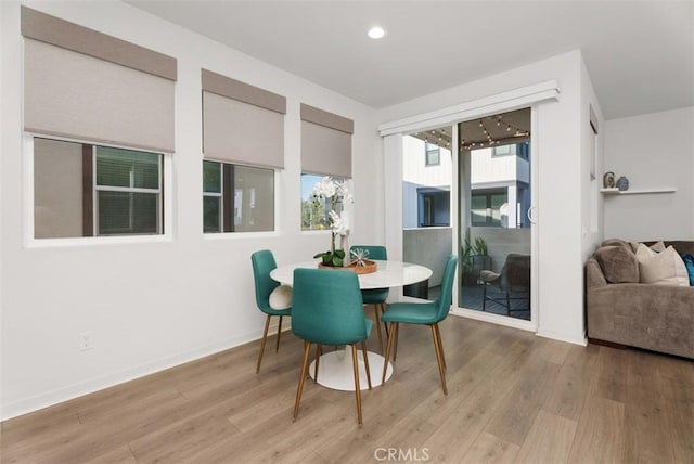 dining area with light wood-type flooring