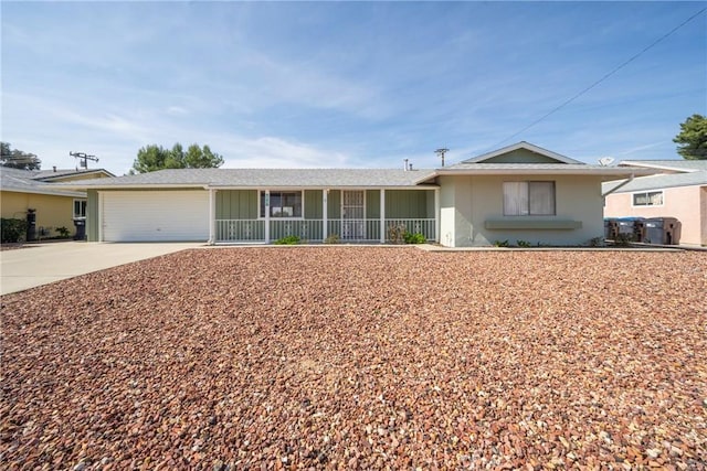 ranch-style home with a garage and covered porch