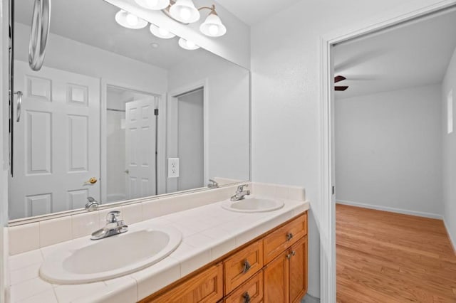 bathroom with vanity and hardwood / wood-style floors