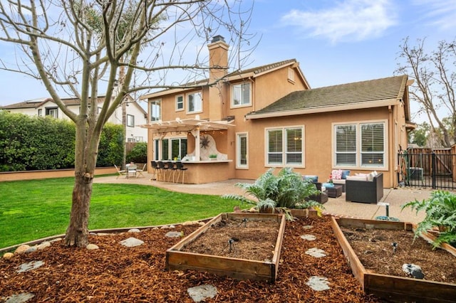 back of property with a patio, outdoor lounge area, exterior bar, a yard, and a pergola