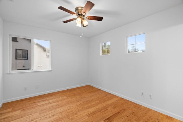 unfurnished room with light hardwood / wood-style floors and ceiling fan