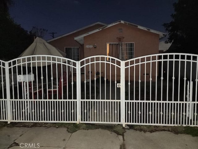 view of gate at night