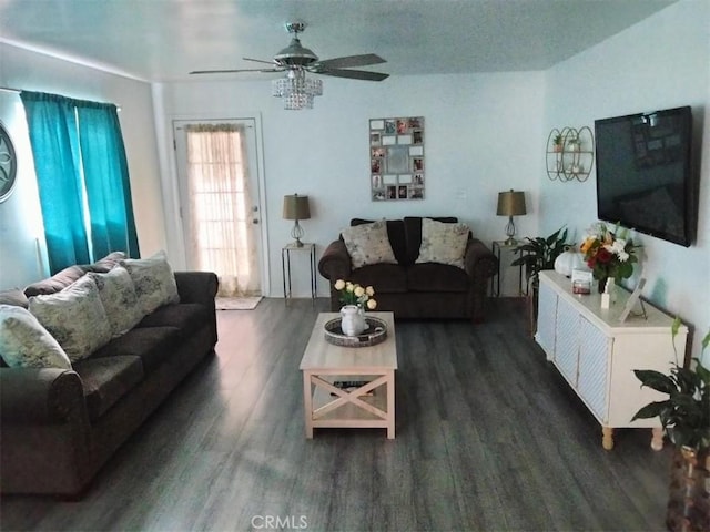 living room with a ceiling fan and wood finished floors