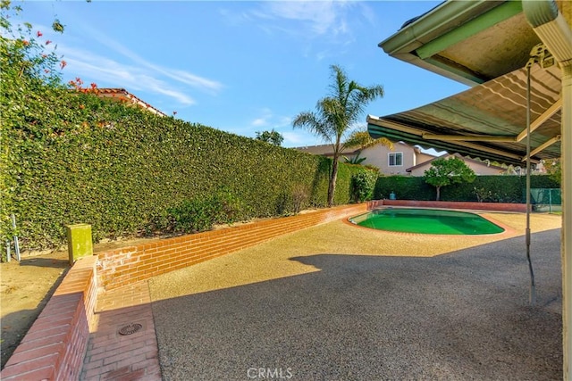 view of community featuring a pool and a patio area