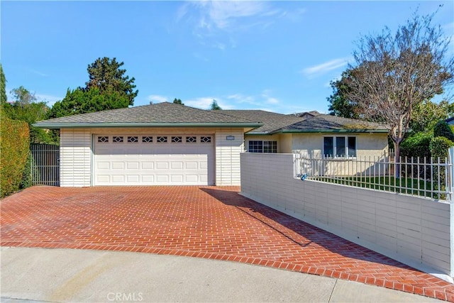 ranch-style house featuring a garage