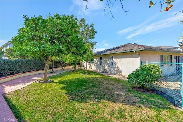 view of home's exterior with a yard