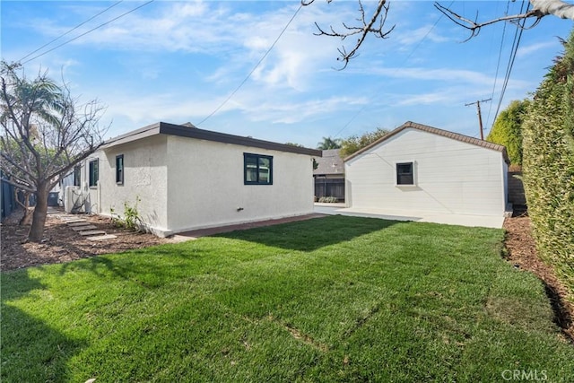 back of house featuring a yard