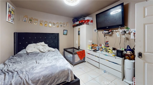 bedroom featuring light tile patterned floors