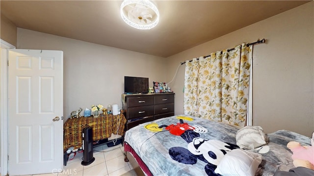 bedroom with light tile patterned floors