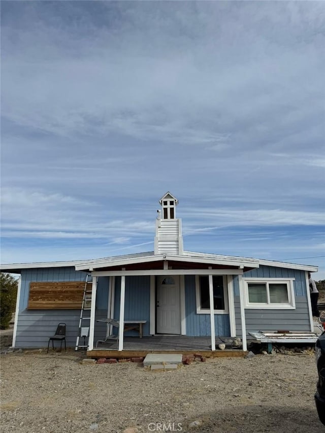 view of front of property with covered porch and board and batten siding