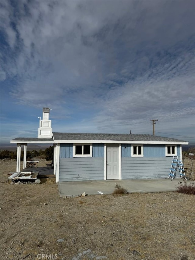 back of house with a patio