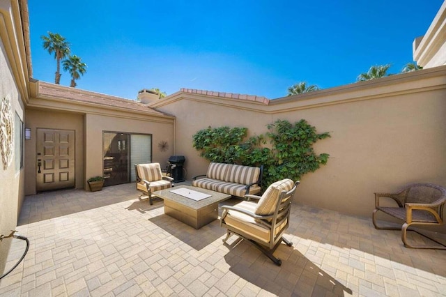 view of patio with an outdoor fire pit