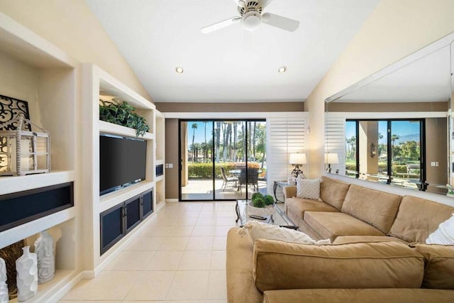 tiled living room with built in shelves, ceiling fan, and vaulted ceiling