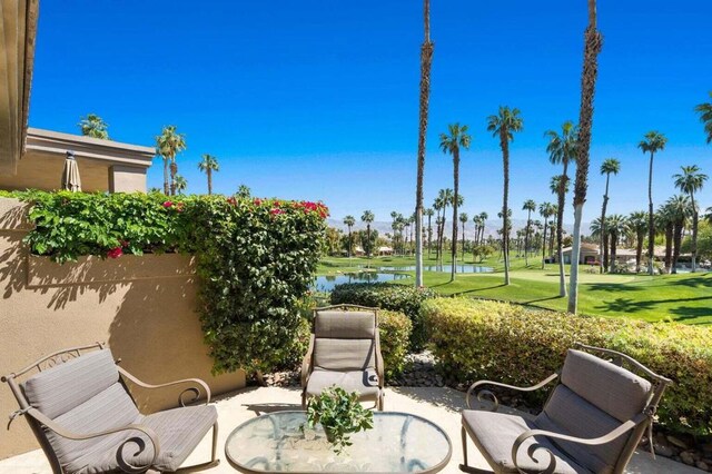 view of patio featuring a water view