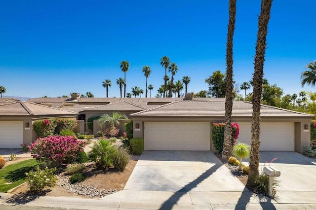 ranch-style house featuring a garage