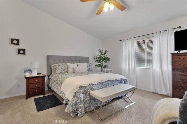 carpeted bedroom with vaulted ceiling and ceiling fan