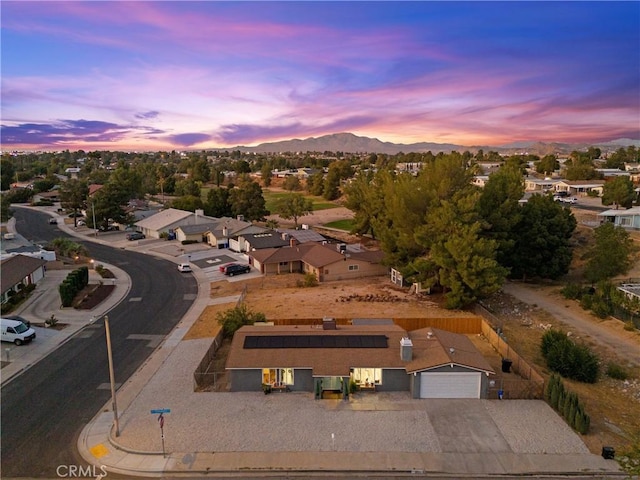 aerial view at dusk with a mountain view