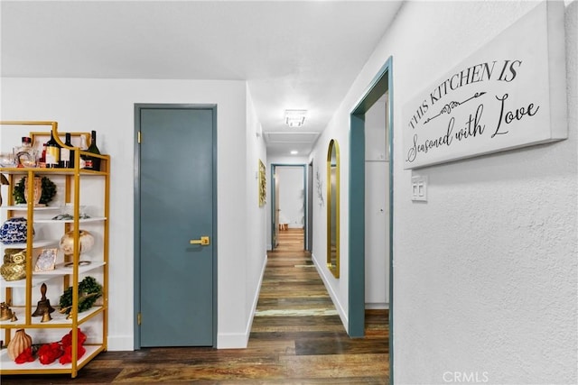 corridor with dark hardwood / wood-style floors