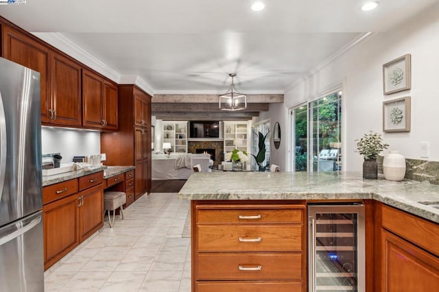 kitchen with wine cooler, light stone counters, stainless steel fridge, and ornamental molding