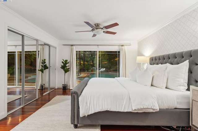 bedroom featuring dark hardwood / wood-style flooring, crown molding, and access to outside