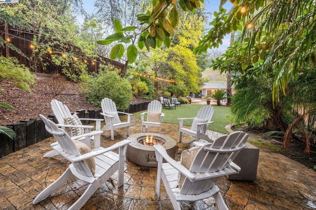 view of patio with a fire pit