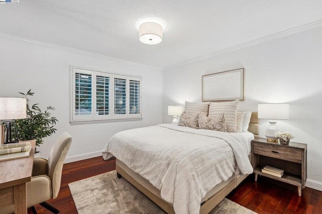 bedroom featuring crown molding and dark wood-type flooring