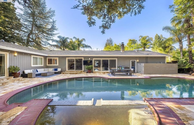 view of pool featuring an outdoor living space and a patio