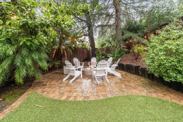 view of patio with a fire pit