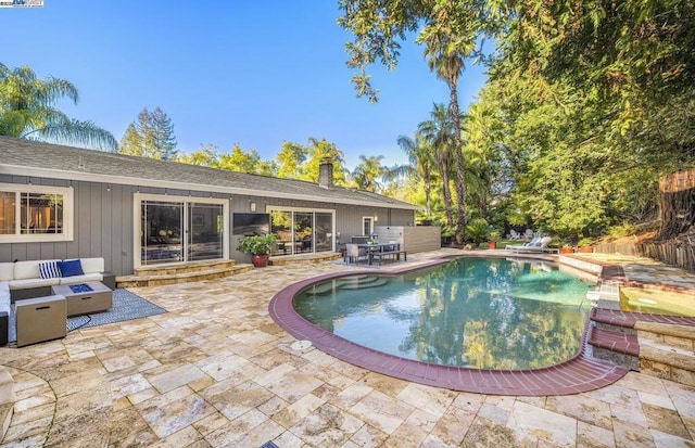 view of swimming pool with an outdoor hangout area and a patio