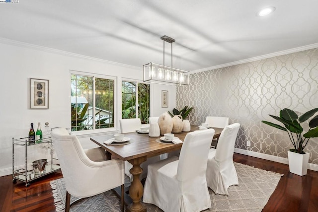 dining room with dark wood-type flooring and ornamental molding