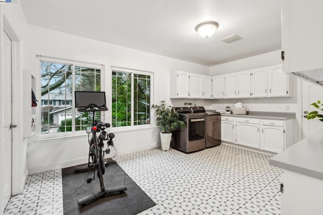 workout area with washing machine and dryer