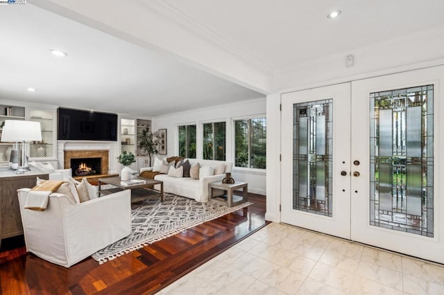 living room featuring french doors and ornamental molding