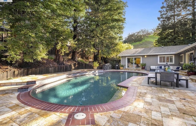 view of swimming pool featuring a patio area