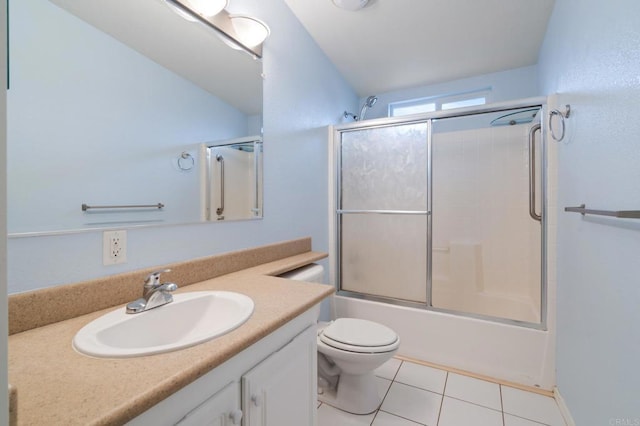 full bathroom with tile patterned flooring, vanity, shower / bath combination with glass door, and toilet