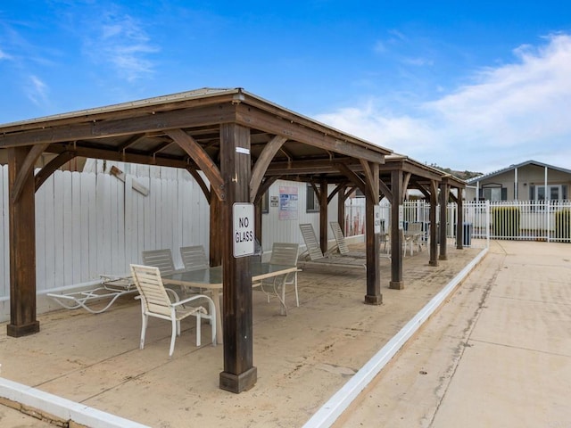 surrounding community with a gazebo and a patio