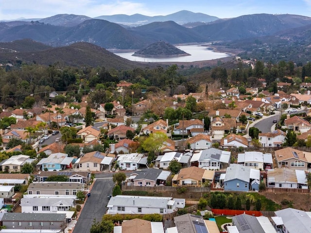 birds eye view of property featuring a water and mountain view